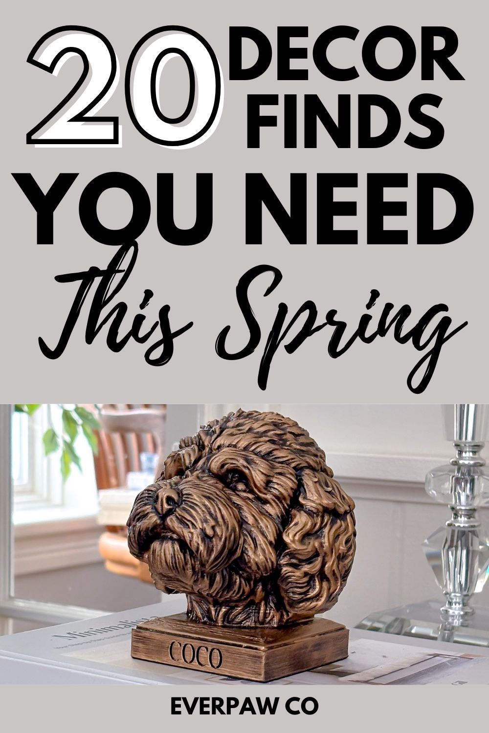 Golden doodle dog sculpture on a stack of books in a bright, elegant living room — featured in a “20 Decor Finds You Need This Spring” roundup.